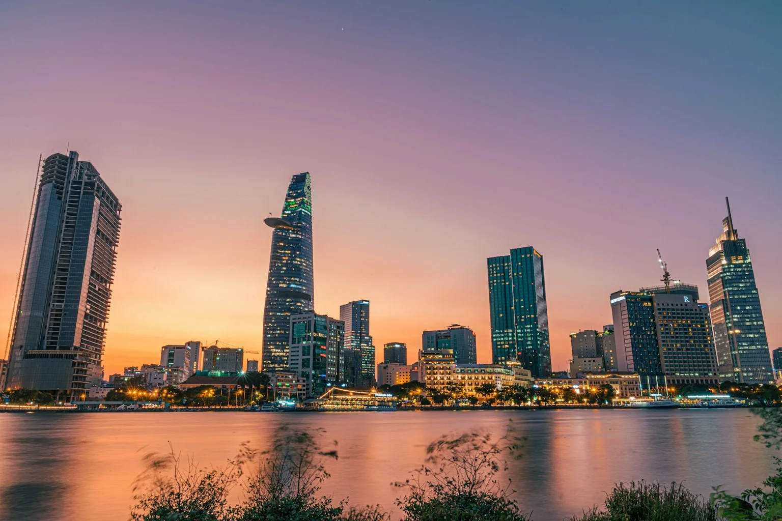 Bustling city street and illuminated skyline of Ho Chi Minh City, Vietnam